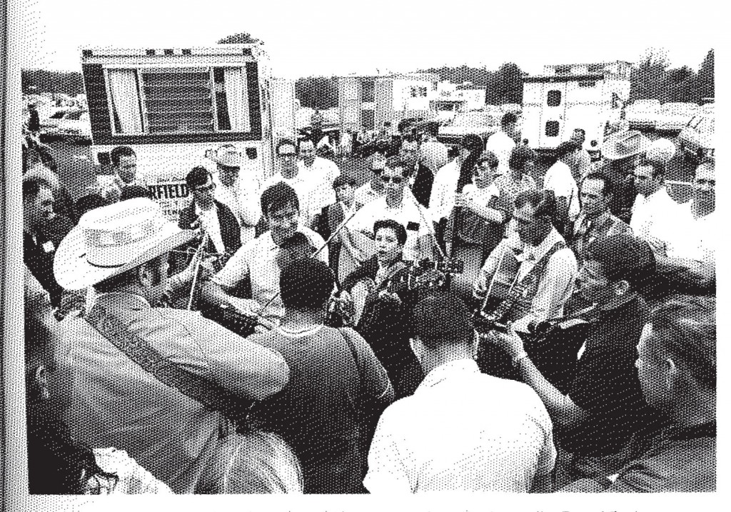 David DeJean, photograph of jam session in Jamboree parking lot, 1969, in Thomas Adler, Bean Blossom: The Brown County Jamboree and Bill Monroe's Bluegrass Festivals